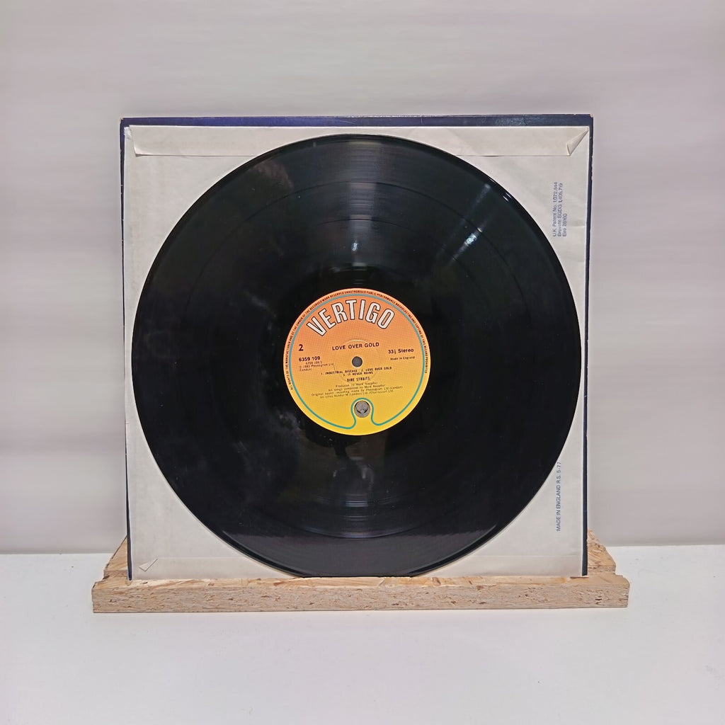 Dire Straits love over gold vinyl record VG+/VG+ 6359 109